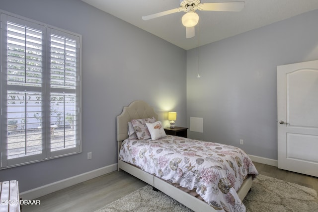 bedroom featuring ceiling fan and light hardwood / wood-style flooring