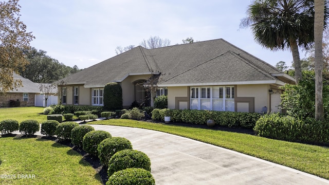 ranch-style house with a front lawn