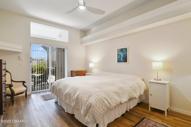 bedroom featuring dark wood-type flooring, access to outside, and ceiling fan