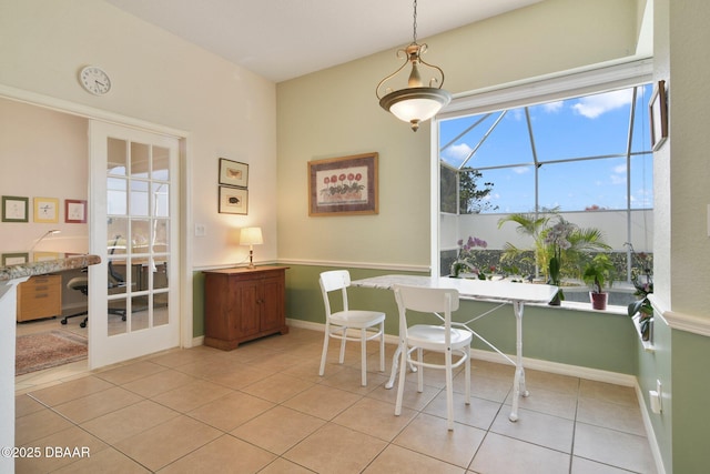 dining space featuring light tile patterned floors