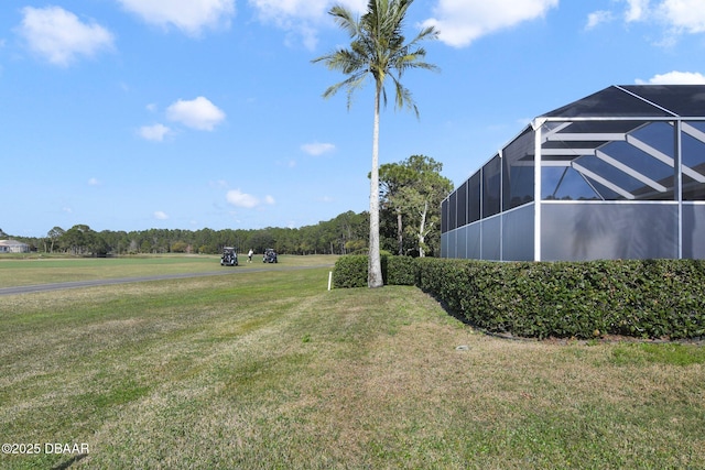 view of yard with a lanai