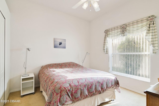 bedroom featuring ceiling fan and carpet floors