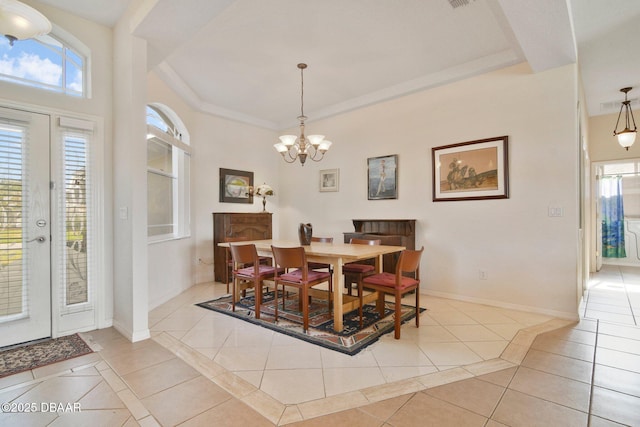 dining area with light tile patterned flooring, an inviting chandelier, and french doors