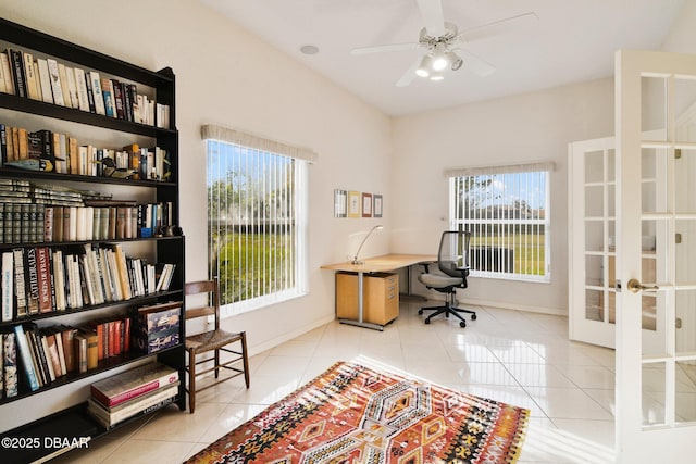 tiled office space with french doors and ceiling fan