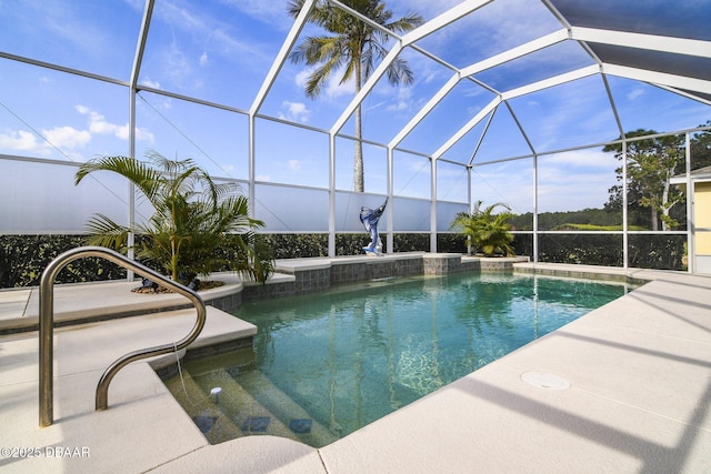 view of pool with a lanai and a patio area