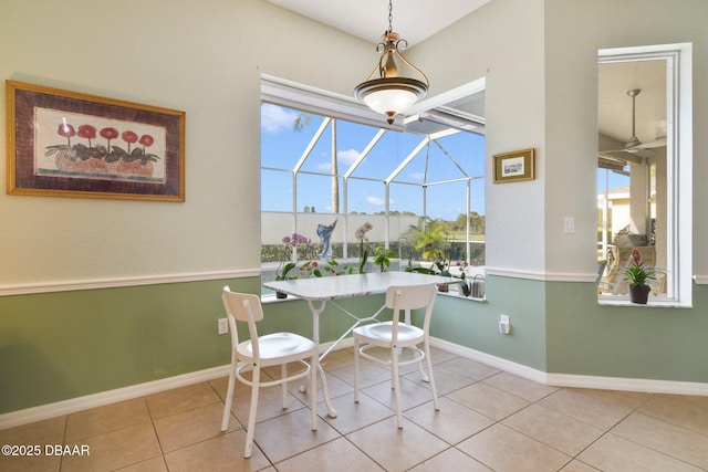 dining space featuring light tile patterned floors