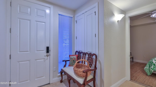 entryway with light tile patterned flooring