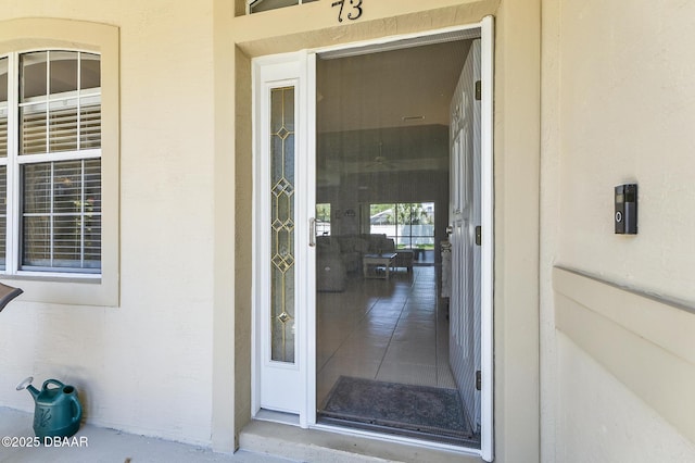 73 Foxhall Ln, Palm Coast, FL 32137 - view of exterior entry with stucco siding