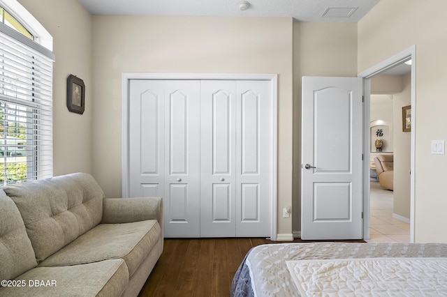 73 Foxhall Ln, Palm Coast, FL 32137 - bedroom featuring a closet, multiple windows, and baseboards