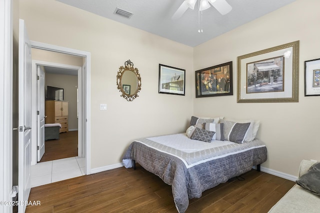 73 Foxhall Ln, Palm Coast, FL 32137 - bedroom with wood finished floors, baseboards, and ceiling fan