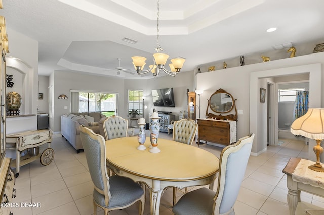 73 Foxhall Ln, Palm Coast, FL 32137 - dining area with a raised ceiling, a chandelier, light tile patterned floors, and ceiling fan