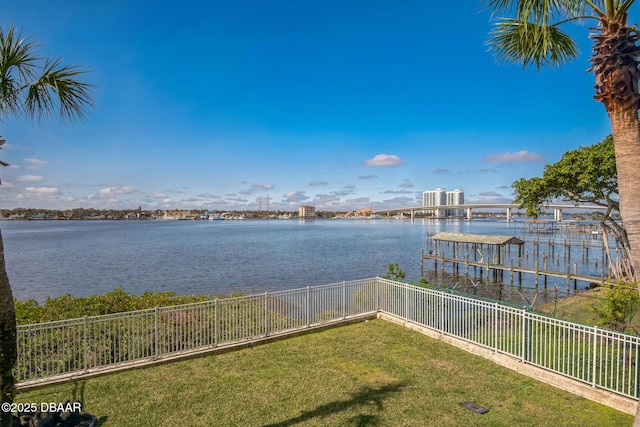 exterior space featuring a dock and fence