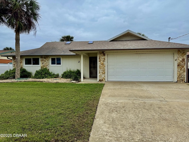 single story home with driveway, stone siding, roof with shingles, an attached garage, and a front yard