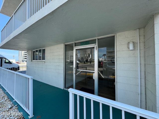 entrance to property with a balcony