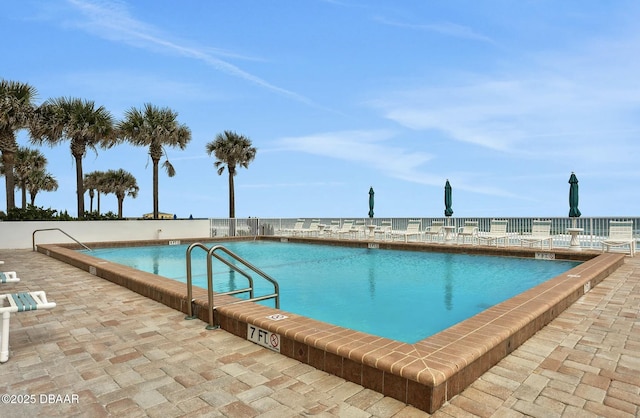 view of swimming pool with a patio area