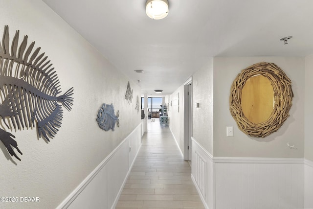 corridor featuring light hardwood / wood-style floors