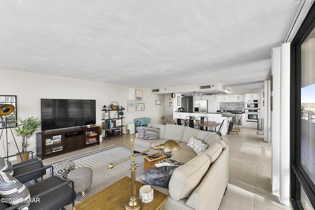 living room with light tile patterned floors