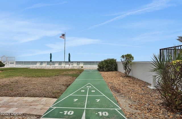 view of community featuring a water view and a lawn