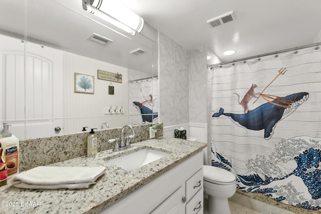 bathroom with vanity, curtained shower, and toilet