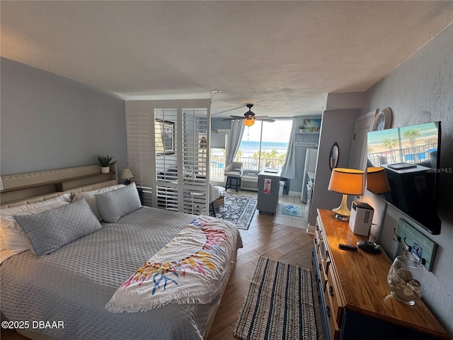 1233 S Atlantic Ave Unit 3070, Daytona Beach, FL 32118 - bedroom featuring access to exterior and ceiling fan