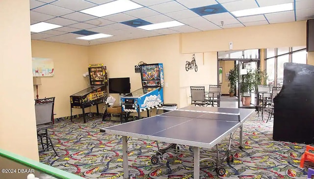 recreation room with a drop ceiling