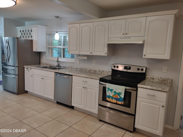 kitchen with a sink, white cabinetry, under cabinet range hood, and stainless steel appliances