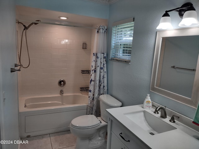 bathroom with tile patterned floors, toilet, shower / bath combination with curtain, vanity, and a textured wall