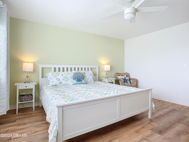 bedroom with ceiling fan and light hardwood / wood-style flooring