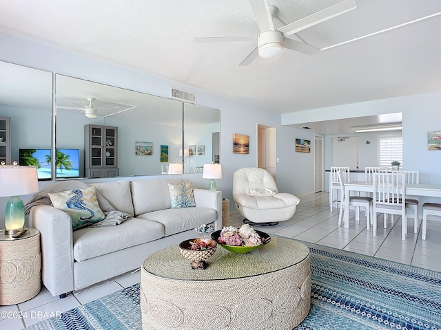 living room with light tile patterned flooring and ceiling fan