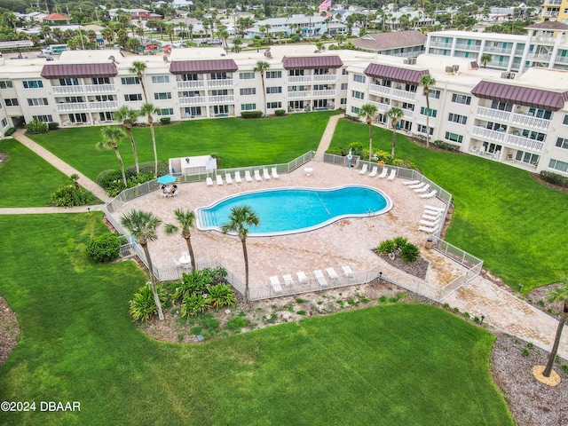 view of swimming pool with a lawn and a patio area