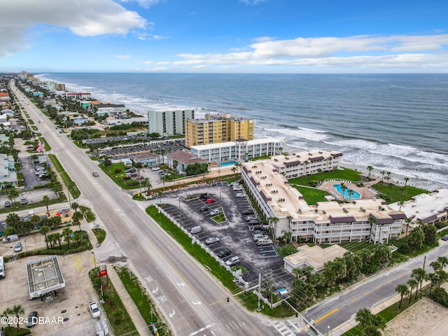 bird's eye view with a view of the beach and a water view