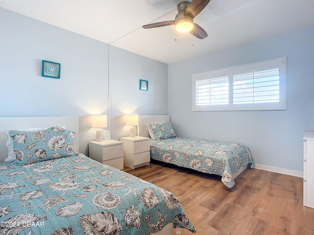 bedroom featuring light hardwood / wood-style floors and ceiling fan