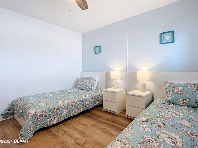 bedroom featuring light hardwood / wood-style flooring and ceiling fan