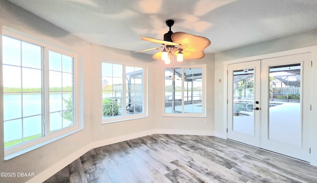 3128 John Anderson Dr, Ormond Beach, FL 32176 - unfurnished sunroom featuring french doors and a water view