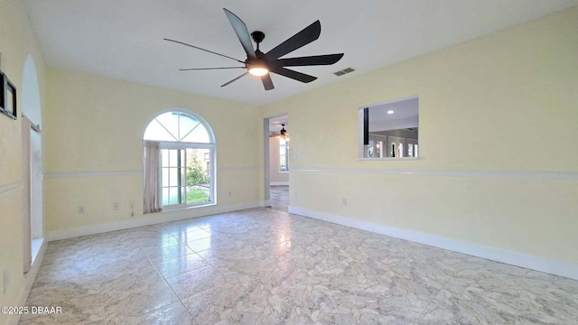 3128 John Anderson Dr, Ormond Beach, FL 32176 - unfurnished room with ceiling fan and marble look tiles