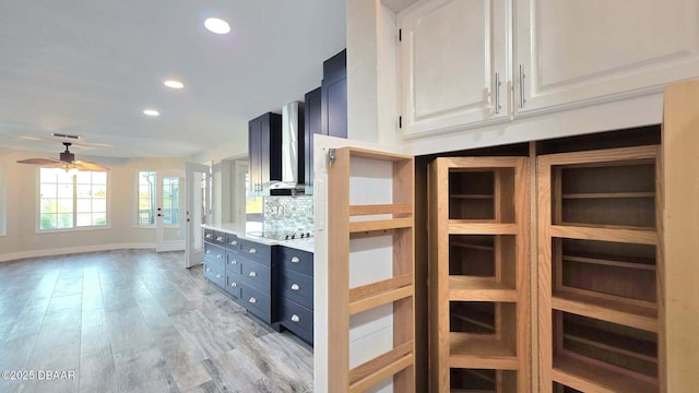 3128 John Anderson Dr, Ormond Beach, FL 32176 - kitchen featuring white cabinets, a ceiling fan, backsplash, dark cabinetry, and recessed lighting