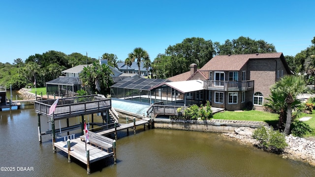 3128 John Anderson Dr, Ormond Beach, FL 32176 - dock featuring boat lift, a water view, a pool, a balcony, and a yard
