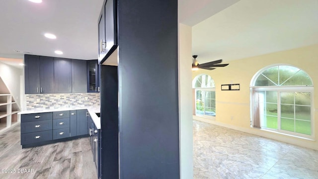 3128 John Anderson Dr, Ormond Beach, FL 32176 - kitchen featuring decorative backsplash, light countertops, ceiling fan, and recessed lighting
