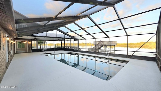 3128 John Anderson Dr, Ormond Beach, FL 32176 - swimming pool featuring a water view, a patio area, and glass enclosure