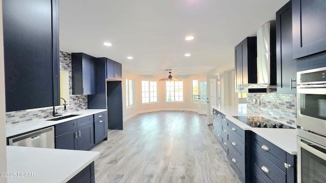 3128 John Anderson Dr, Ormond Beach, FL 32176 - kitchen featuring stainless steel appliances, tasteful backsplash, light countertops, a ceiling fan, and recessed lighting