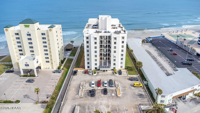 aerial view with a beach view and a water view