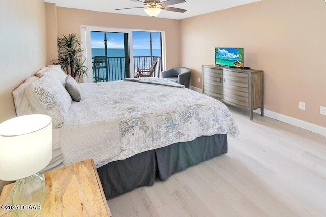 bedroom with hardwood / wood-style flooring, ceiling fan, and access to exterior