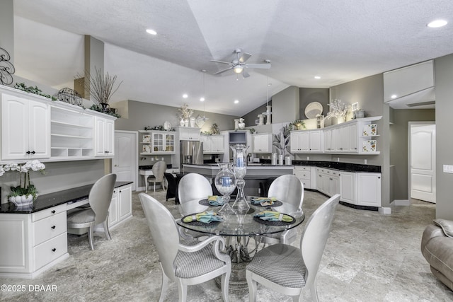 7 Foxfords Chase, Ormond Beach, FL 32174 - dining space with a ceiling fan, lofted ceiling, recessed lighting, built in study area, and a textured ceiling
