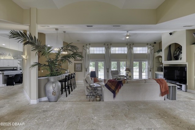 7 Foxfords Chase, Ormond Beach, FL 32174 - living area featuring baseboards and french doors