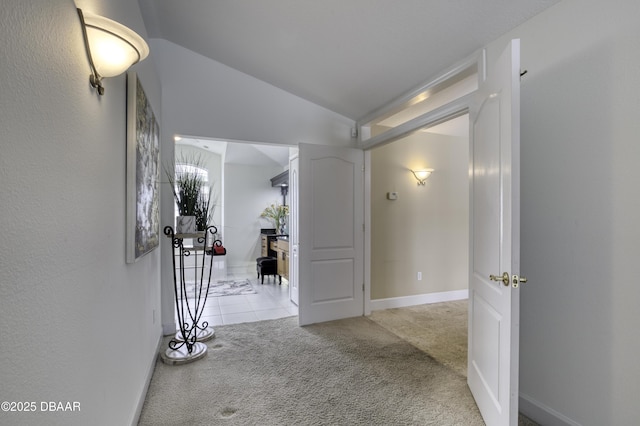 7 Foxfords Chase, Ormond Beach, FL 32174 - corridor featuring carpet, vaulted ceiling, and tile patterned floors
