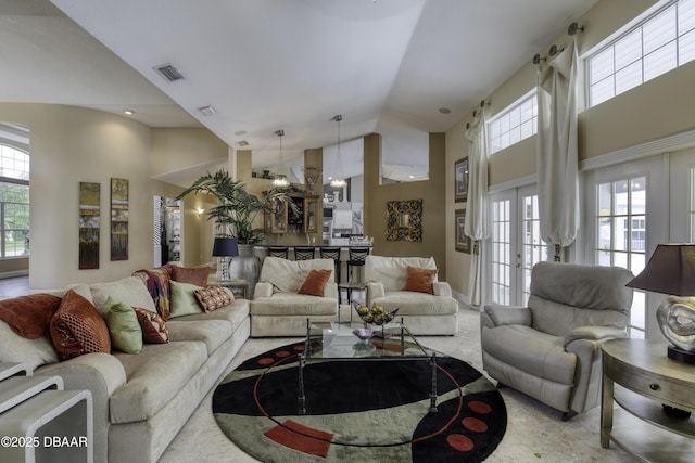 7 Foxfords Chase, Ormond Beach, FL 32174 - living room featuring high vaulted ceiling and french doors