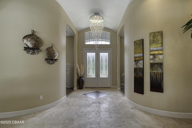 7 Foxfords Chase, Ormond Beach, FL 32174 - entryway with arched walkways, a chandelier, and lofted ceiling