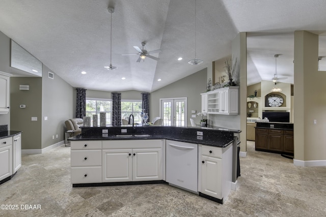 7 Foxfords Chase, Ormond Beach, FL 32174 - kitchen with white dishwasher, vaulted ceiling, a ceiling fan, open floor plan, and a textured ceiling