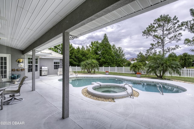 7 Foxfords Chase, Ormond Beach, FL 32174 - view of pool with a grill, a patio area, a fenced backyard, and an in-ground hot tub