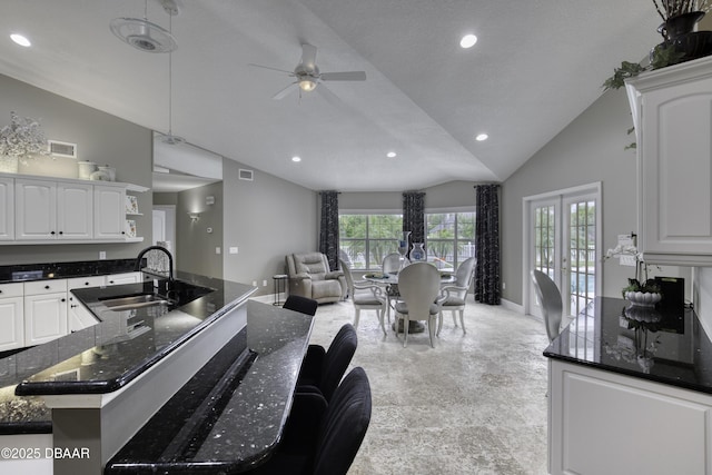 7 Foxfords Chase, Ormond Beach, FL 32174 - kitchen with vaulted ceiling, open floor plan, recessed lighting, a ceiling fan, and white cabinetry